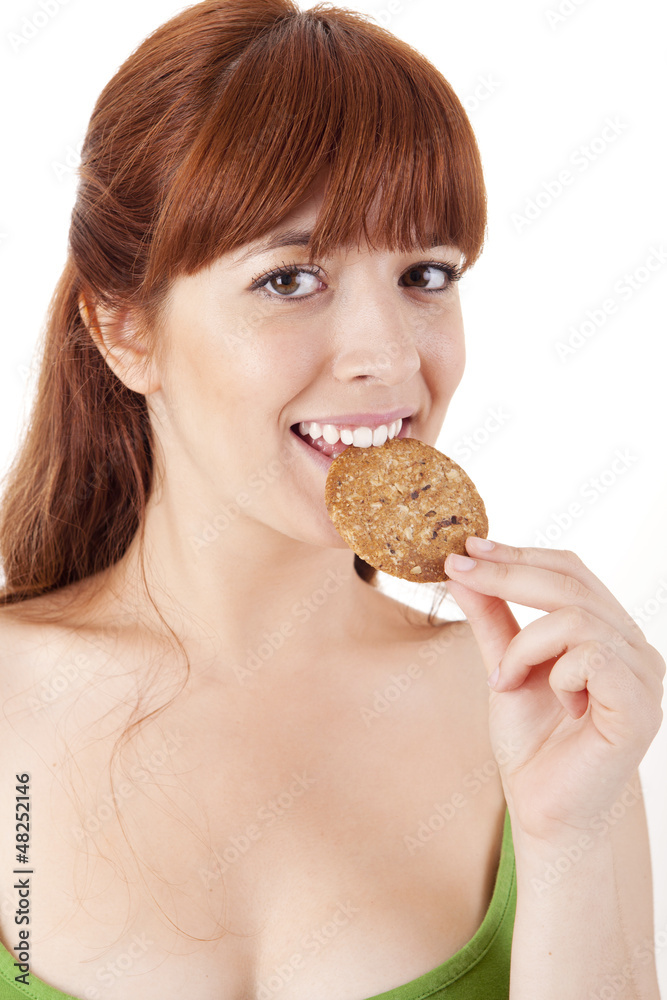 Beautiful young woman eating diet biscuits Beautiful young woman eating diet biscuits