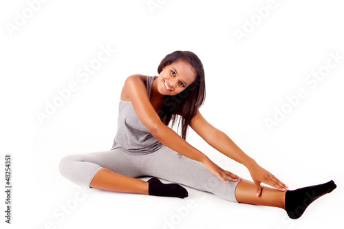 Pretty young african woman doing exercise