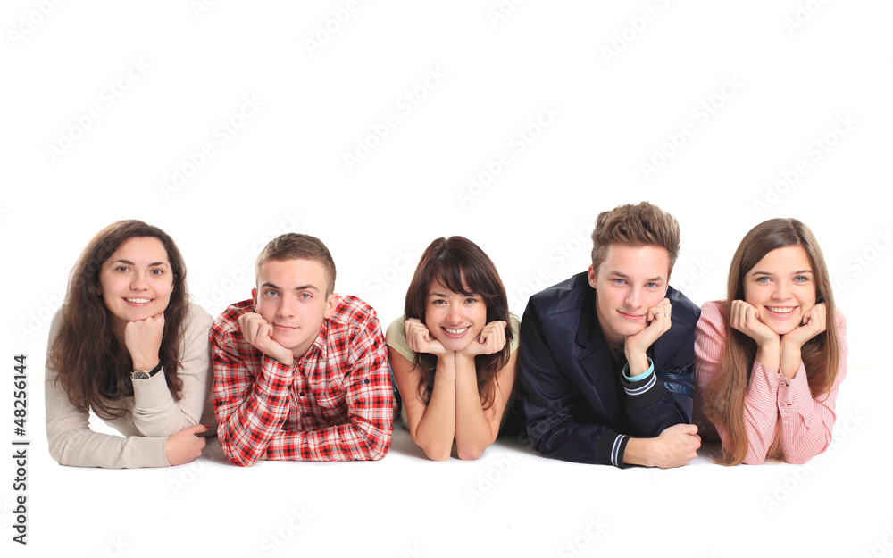 Group of people lying on the floor isolated over a white Group of people lying on the floor isolated over a white
