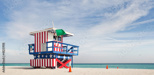 Miami Beach, Florida American flag lifeguard house © FotoMak
