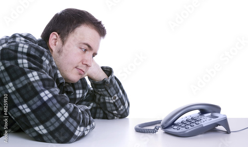 man waiting for phone to ring