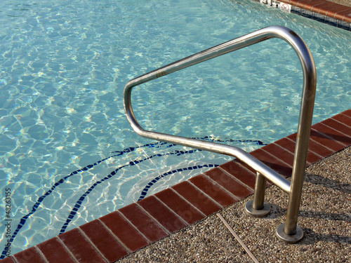 Metal handrail at a swiming pool