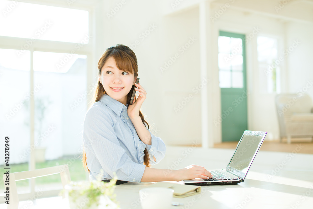 Beautiful asian businesswoman using a laptop computer