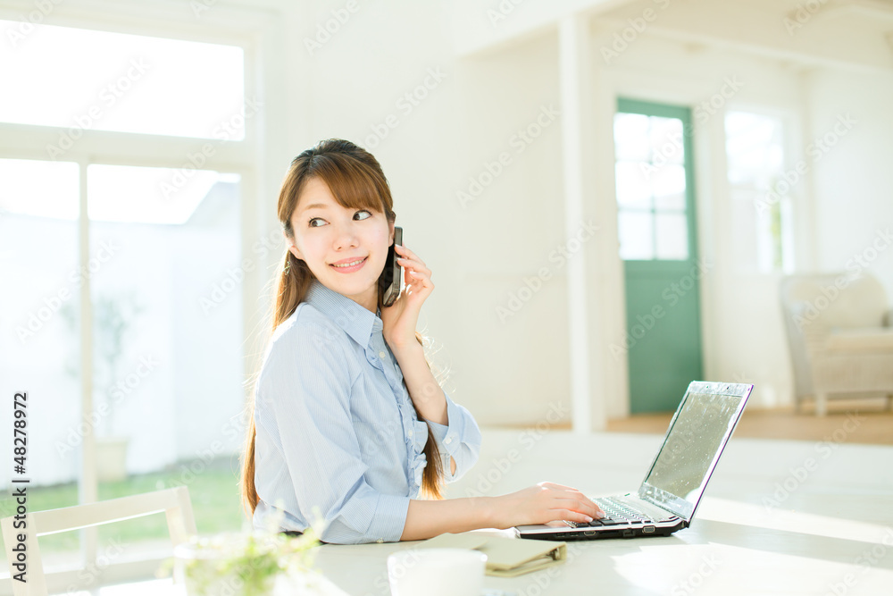 Beautiful asian businesswoman using a laptop computer Beautiful asian businesswoman using a laptop computer