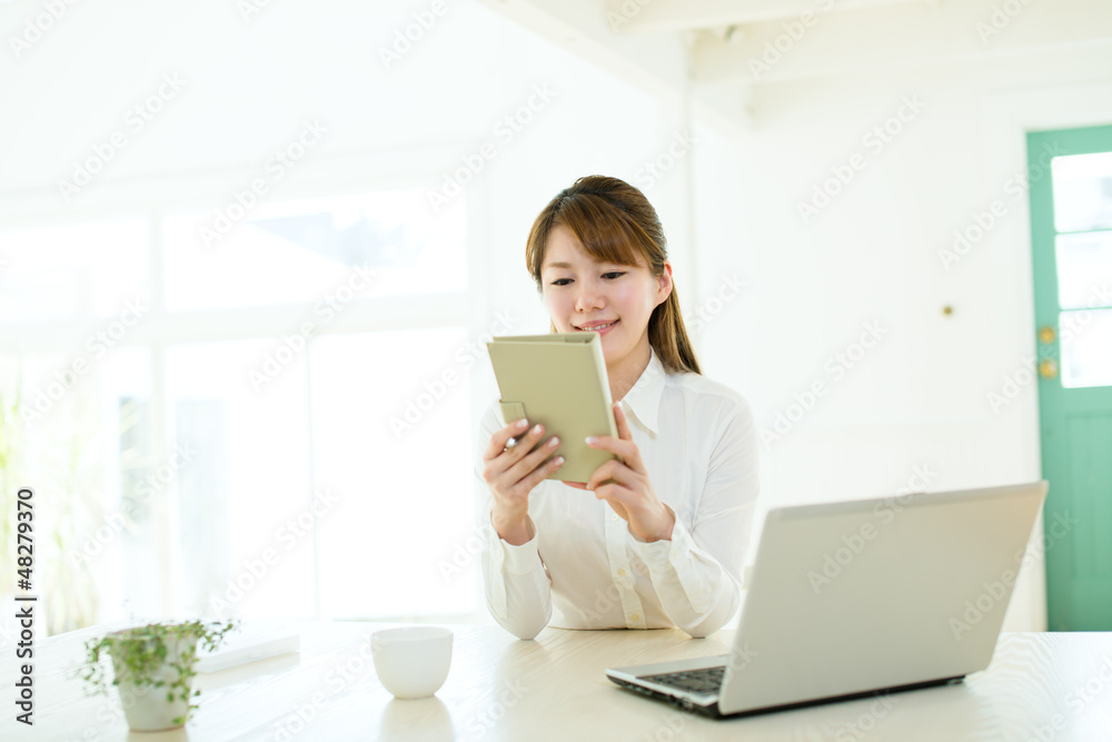 Beautiful asian businesswoman using a laptop computer Beautiful asian businesswoman using a laptop computer