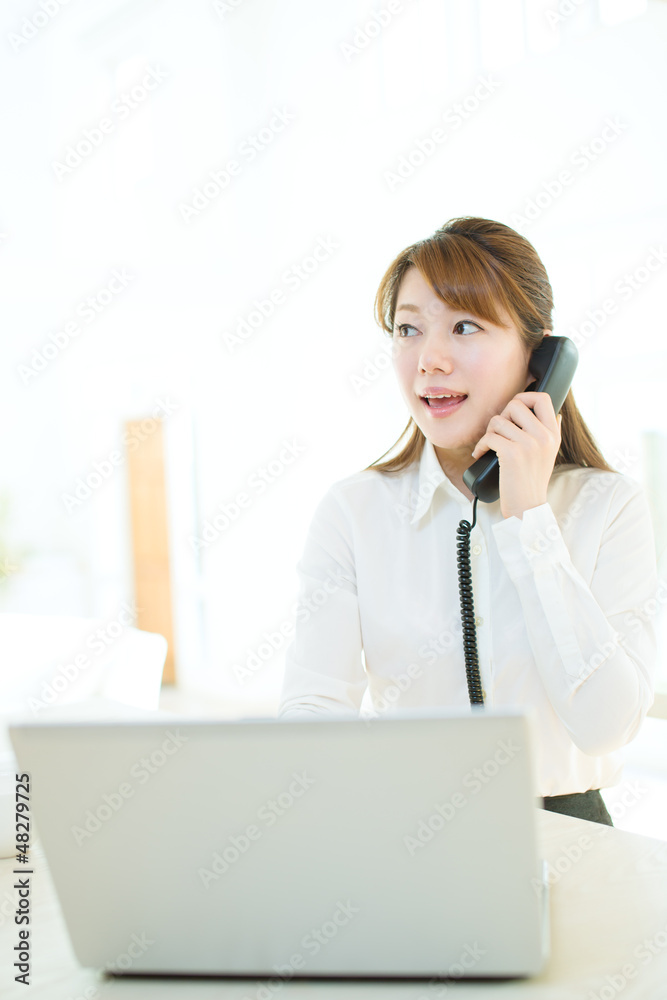 Beautiful asian businesswoman using a laptop computer Beautiful asian businesswoman using a laptop computer