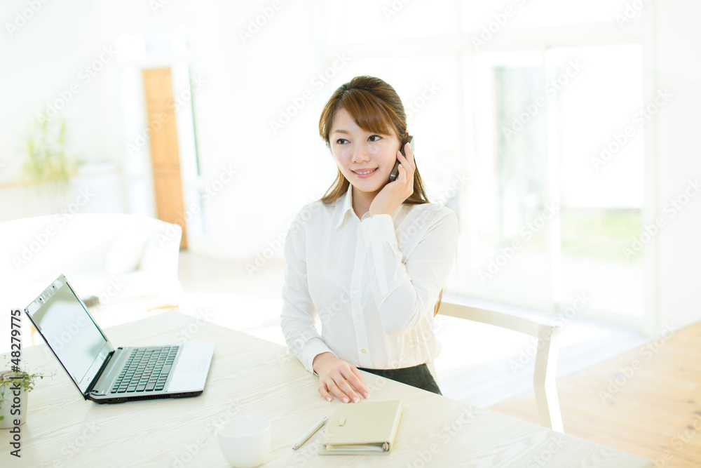 Beautiful asian businesswoman using a laptop computer Beautiful asian businesswoman using a laptop computer