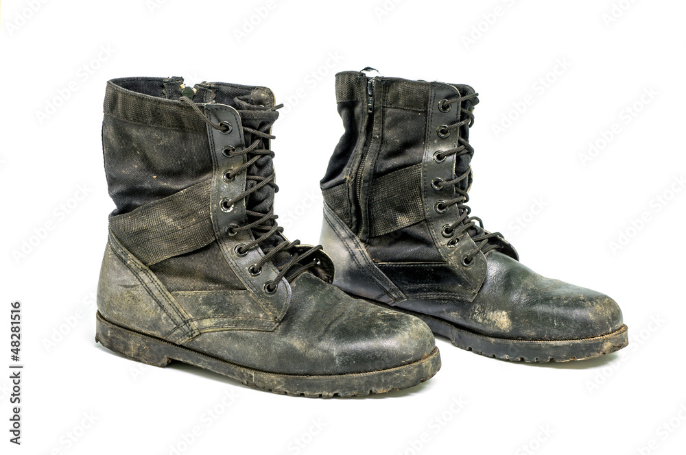 Dirty boots isolated on white background.