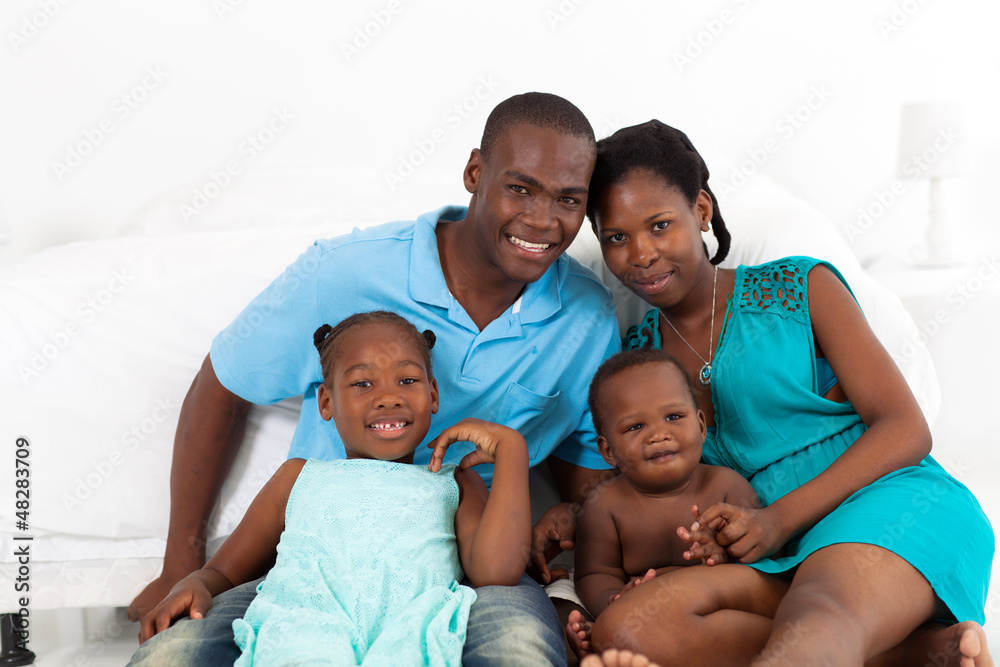 happy african american family in bedroom