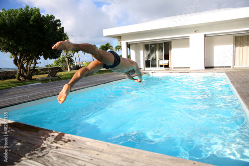Man diving in private swimming-pool