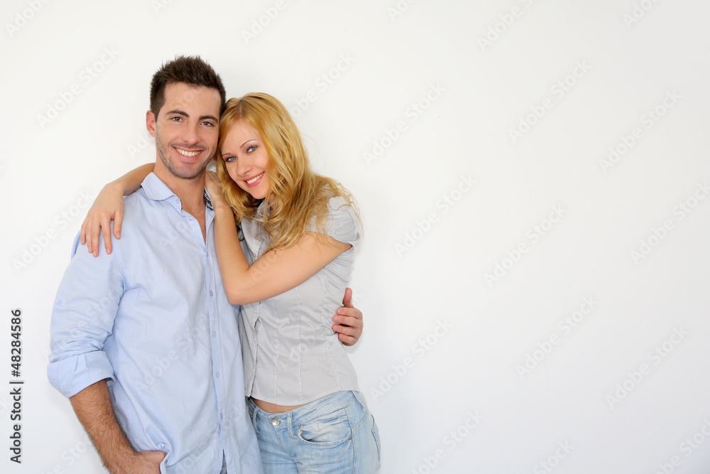 Sweet couple embracing on white background