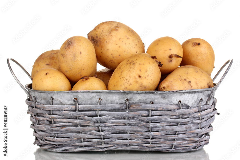 Ripe potatoes on basket isolated on white Ripe potatoes on basket isolated on white