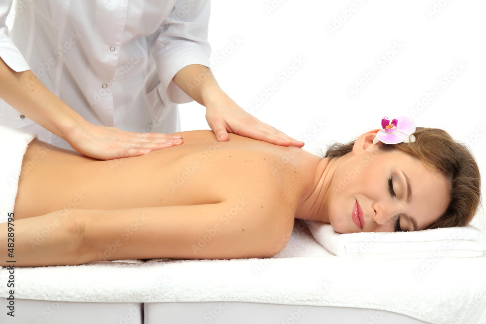 Obraz premium beautiful woman in spa salon getting massage, isolated on