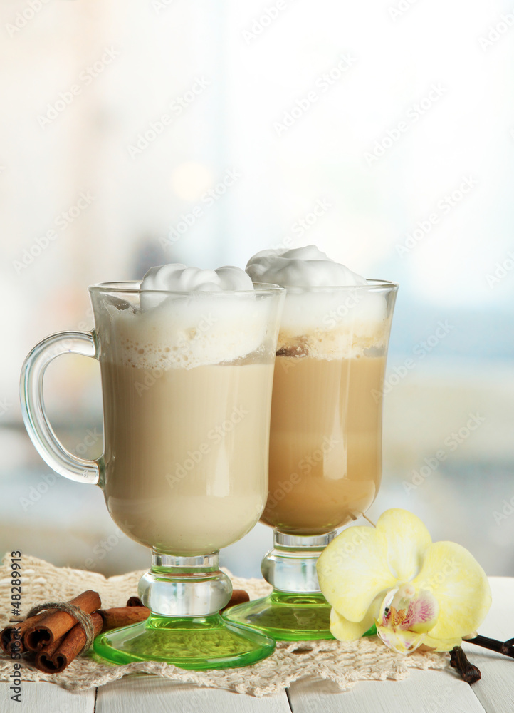 Fragrant coffee latte in glasses cups with spices,