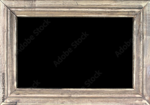 Old picture frame isolated on black background.