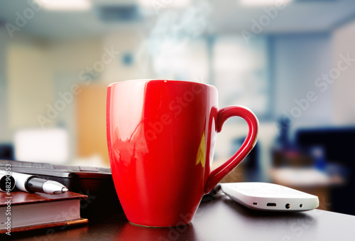 coffee on a black table showing break or breakfast in office