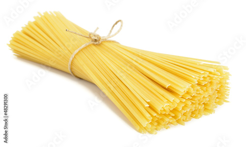 Heap of linguine pasta isolated on white background photo