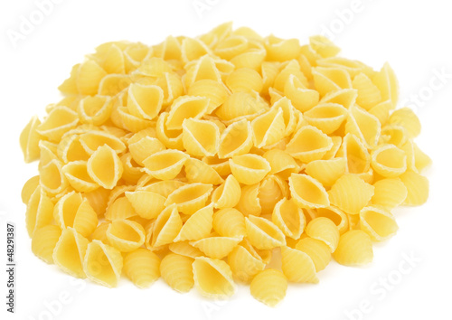 Heap of conchiglie pasta isolated on white background