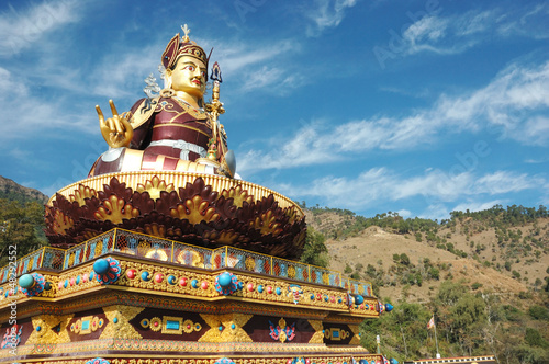 Big golden statue of Padmasambhava in Rewalsar,India photo