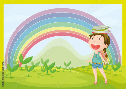 A smiling girl and a rainbow