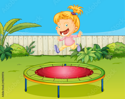 A girl jumping on a trampoline