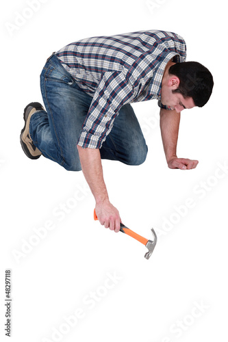 Obraz na plátne Man using a hammer
