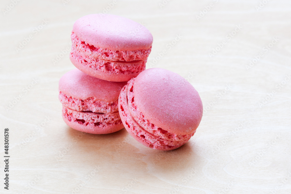 pink macaron on wooden background pink macaron on wooden background