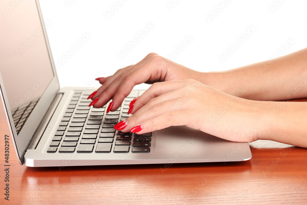 Detail of female hands using computer isolated on white Detail of female hands using computer isolated on white