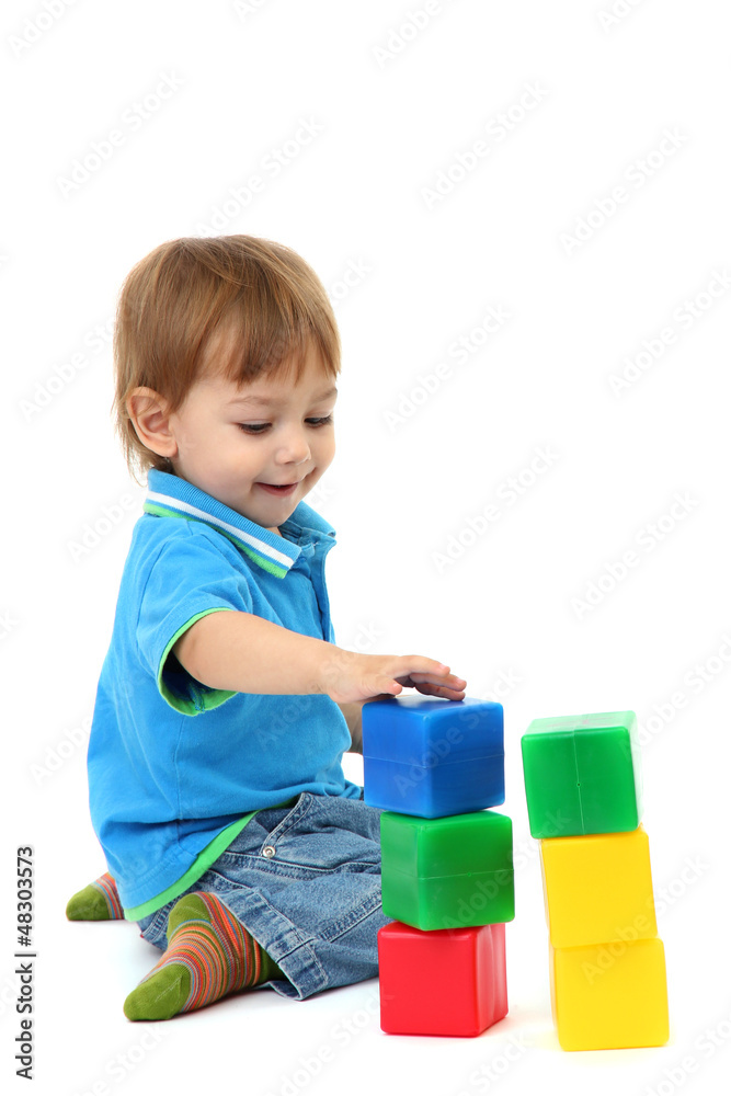cute little boy with toy color cubes, isolated on white