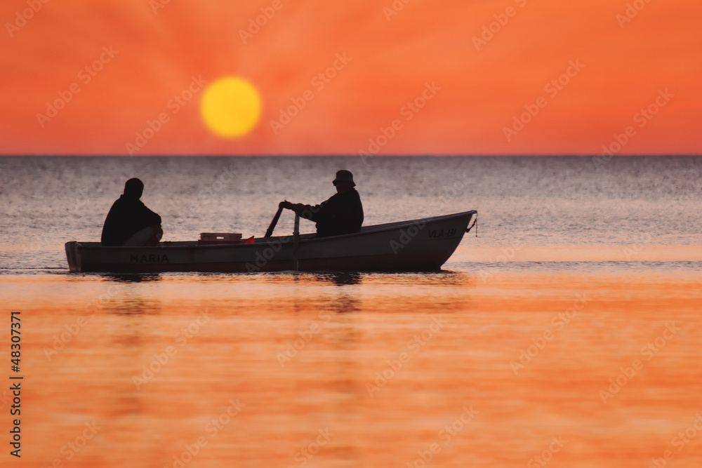 Two men in a fishing boat Stock Photo