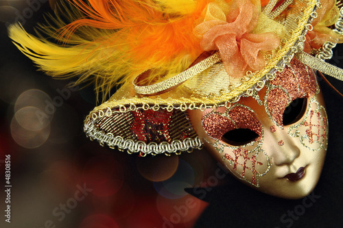 Fototapeta Naklejka Na Ścianę i Meble -  Vintage carnival mask in front of lights background