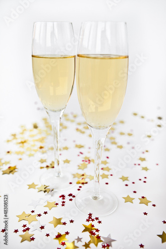 Two Glasses of Champagne with party decorations