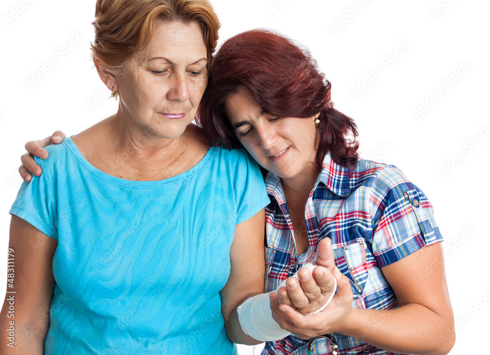 Elderly woman with a broken arm and her caregiver Elderly woman with a broken arm and her caregiver