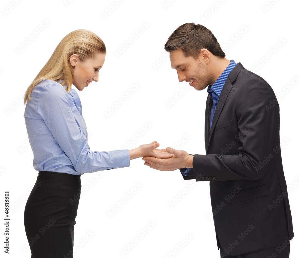 man and woman showing something on the palms man and woman showing something on the palms
