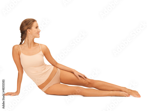 woman in cotton underwear touching her legs