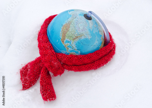 red scarf earth globe sphere winter snow concept