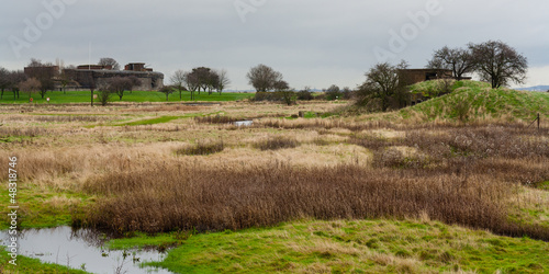 Canvas Print view to old fort over marshland essex uk