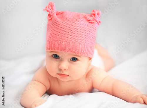 baby girl in pink hat
