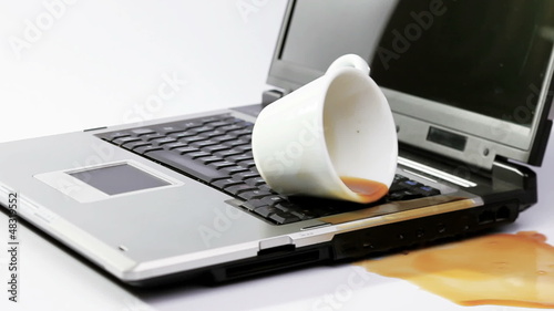 Coffee spilled over working notebook