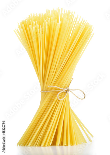Linguine pasta tied with old rope isolated on white background