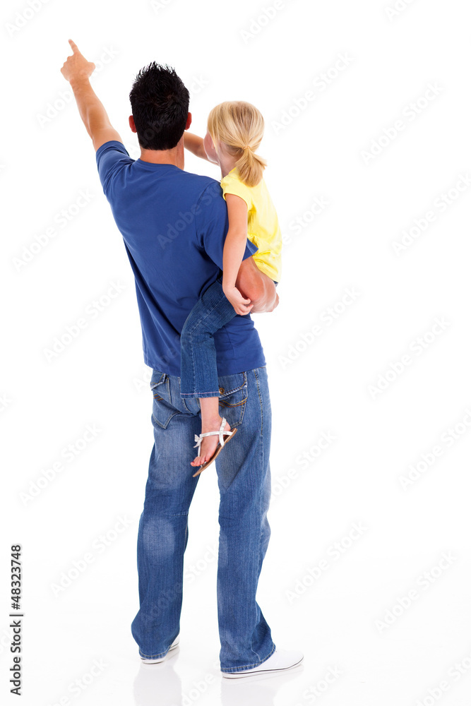 rear view of young father and daughter pointing rear view of young father and daughter pointing