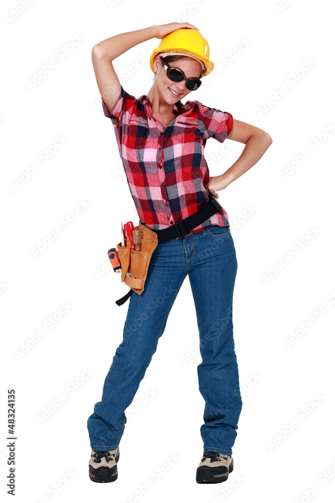 A sexy female construction worker. A sexy female construction worker.