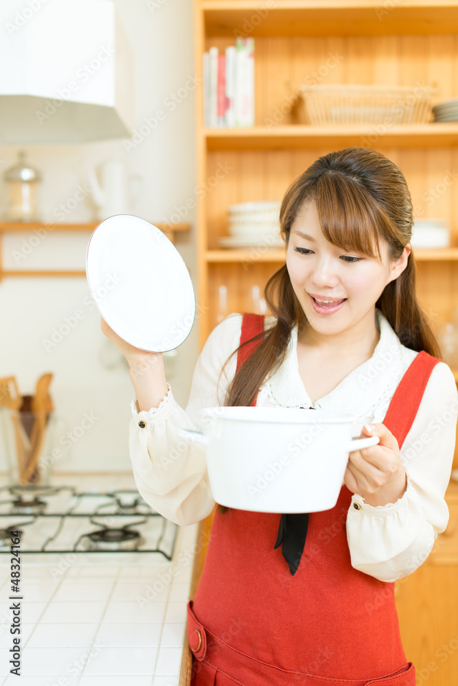 Beautiful asian woman in the kitchen Beautiful asian woman in the kitchen