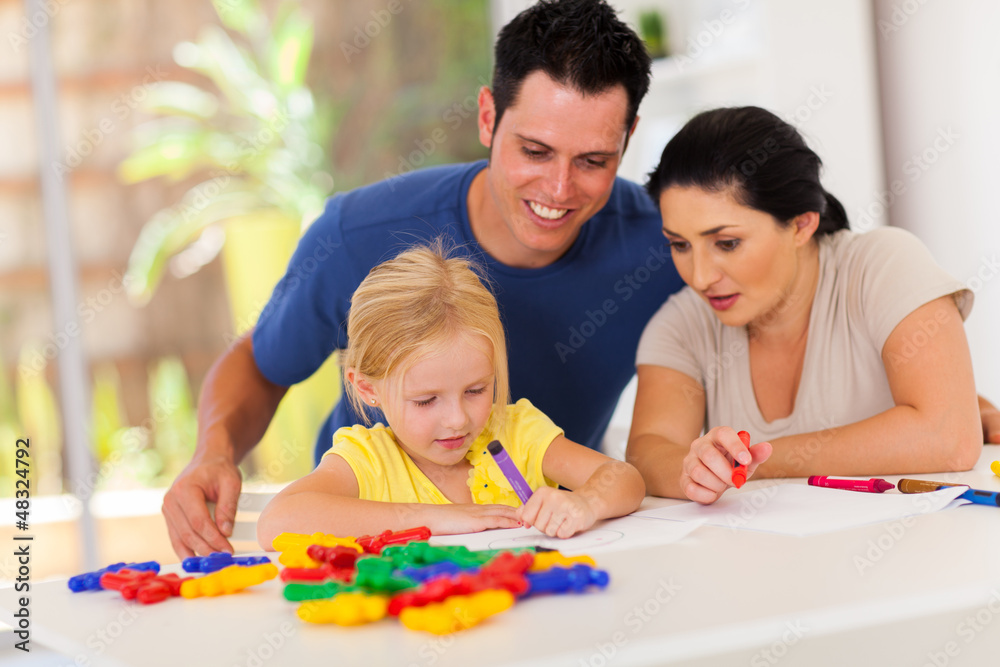 happy parents watching little daughter drawing picture happy parents watching little daughter drawing picture