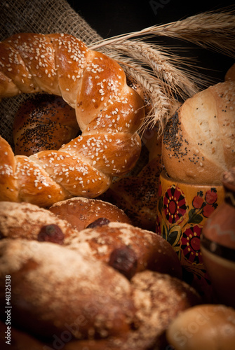 assortment of baked bread on sacking photo