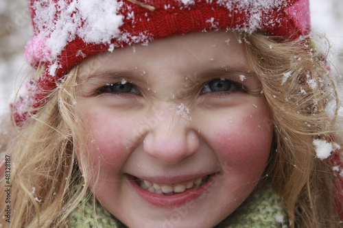 Happy Girl in the Snow with Hat