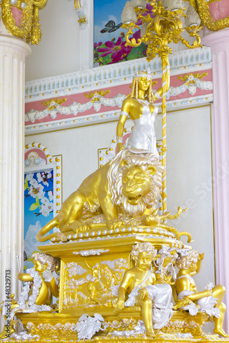 Beautiful plaster cherub detail with gold leaf scallop and oak l photo