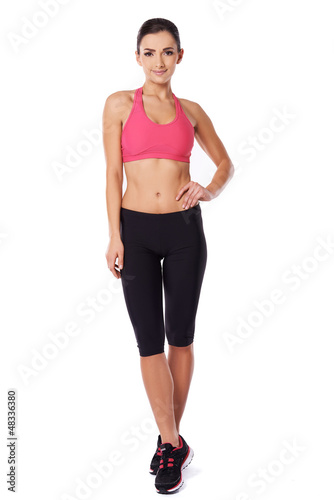 Shapely fit woman in gym tights