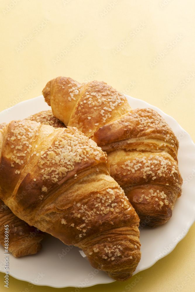 dish with croissants