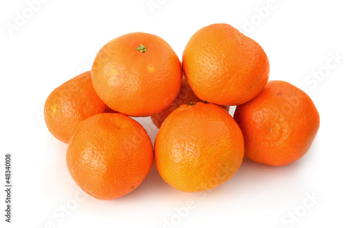 A couple of clementines on white background